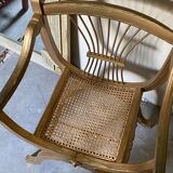 Paire de fauteuils dorés cannés