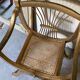 Pair of canework golden armchairs