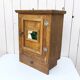 Vintage folk art mirror wall storage unit