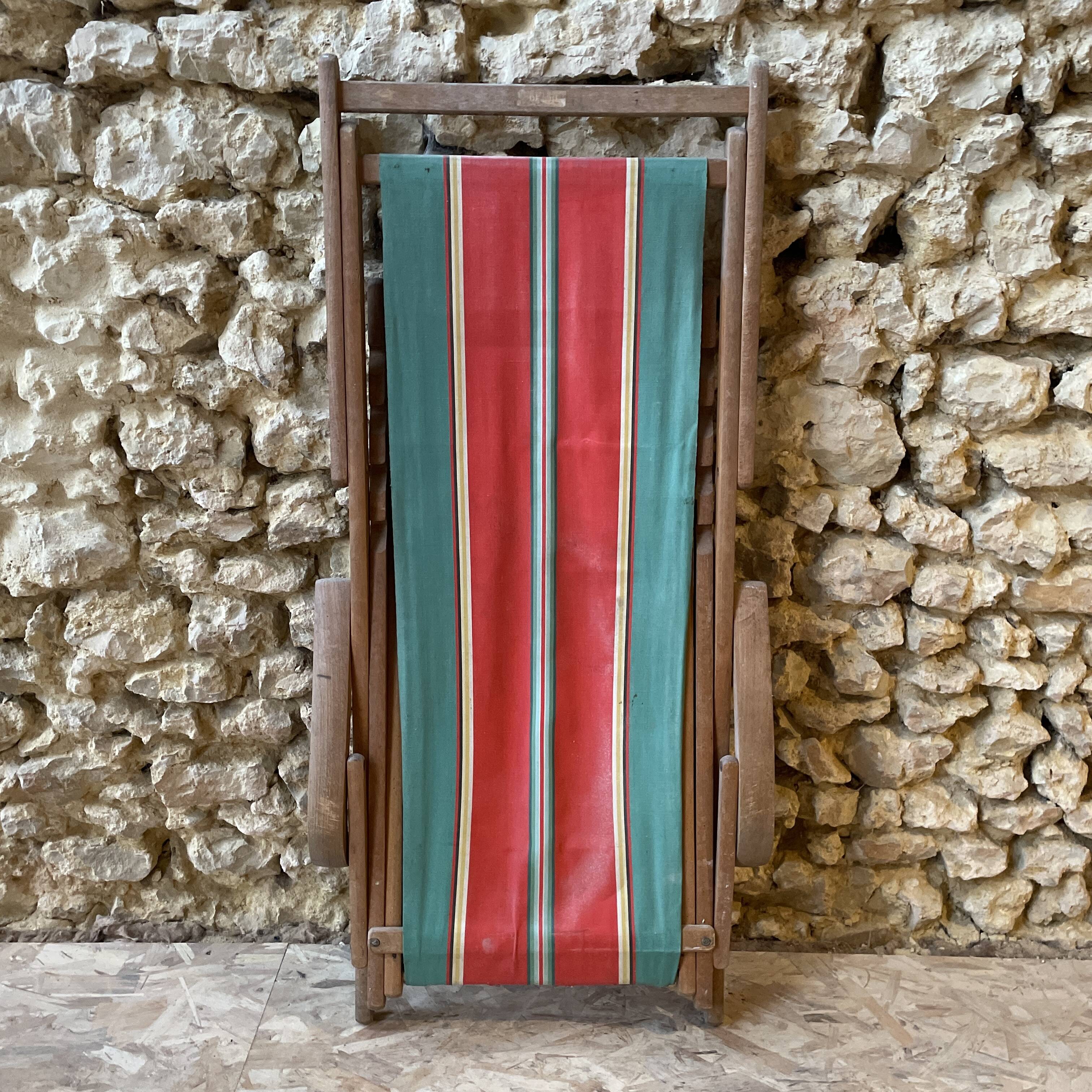 Red and green striped wooden deckchair