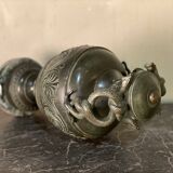 Bronze vase with snakes and a green patina, in the antique style.