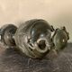 Bronze vase with snakes and a green patina, in the antique style.