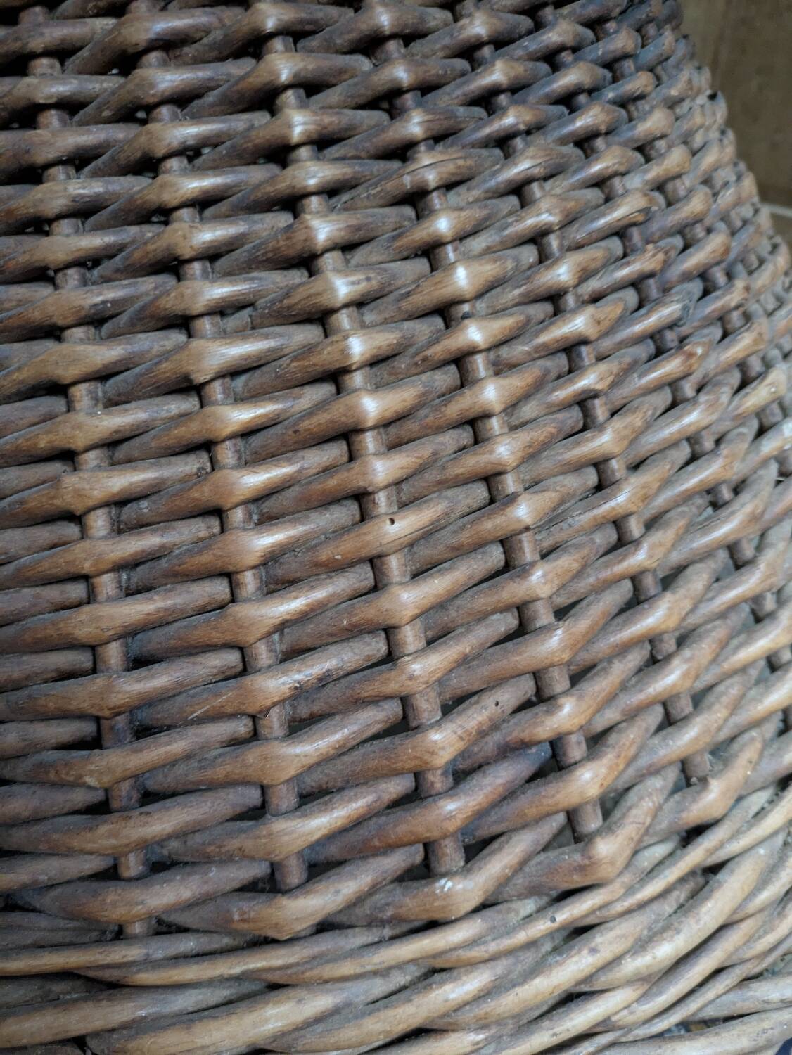 Large woven rattan armchair