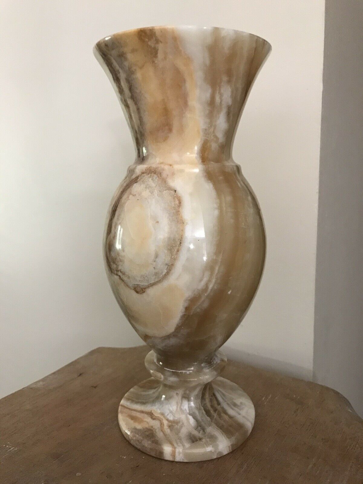 Vintage vase in marbled onyx stone shades of beige and brown