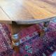 Oval drop-leaf coffee table