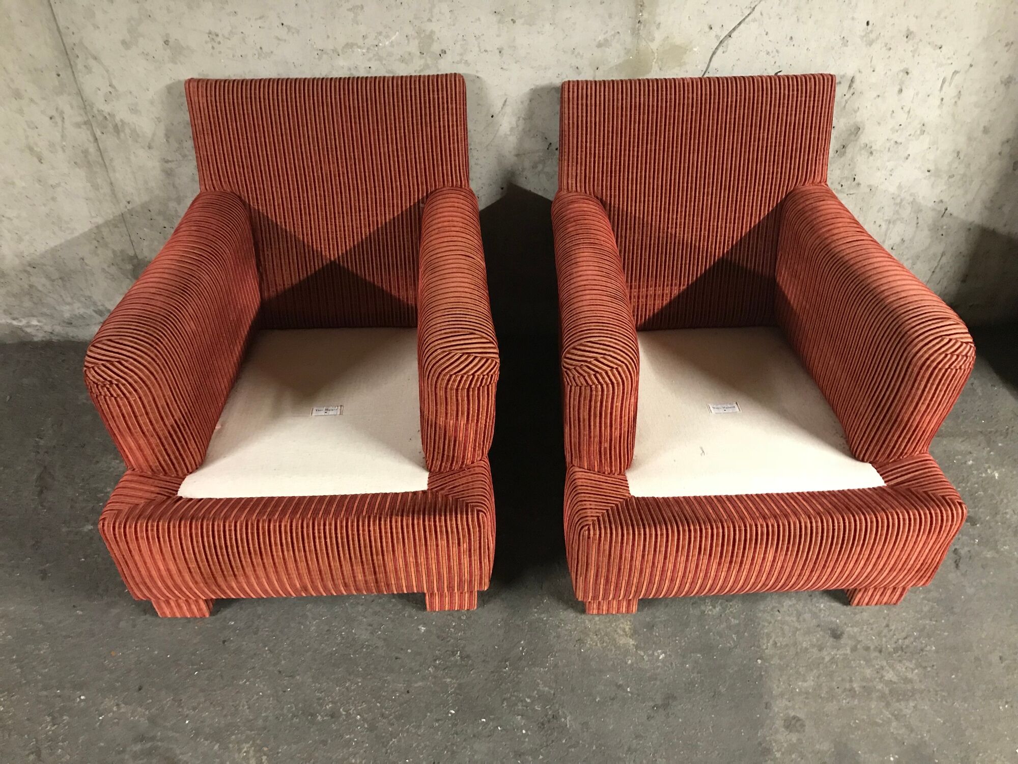 Pair of club in red velvet armchairs Yves Halard