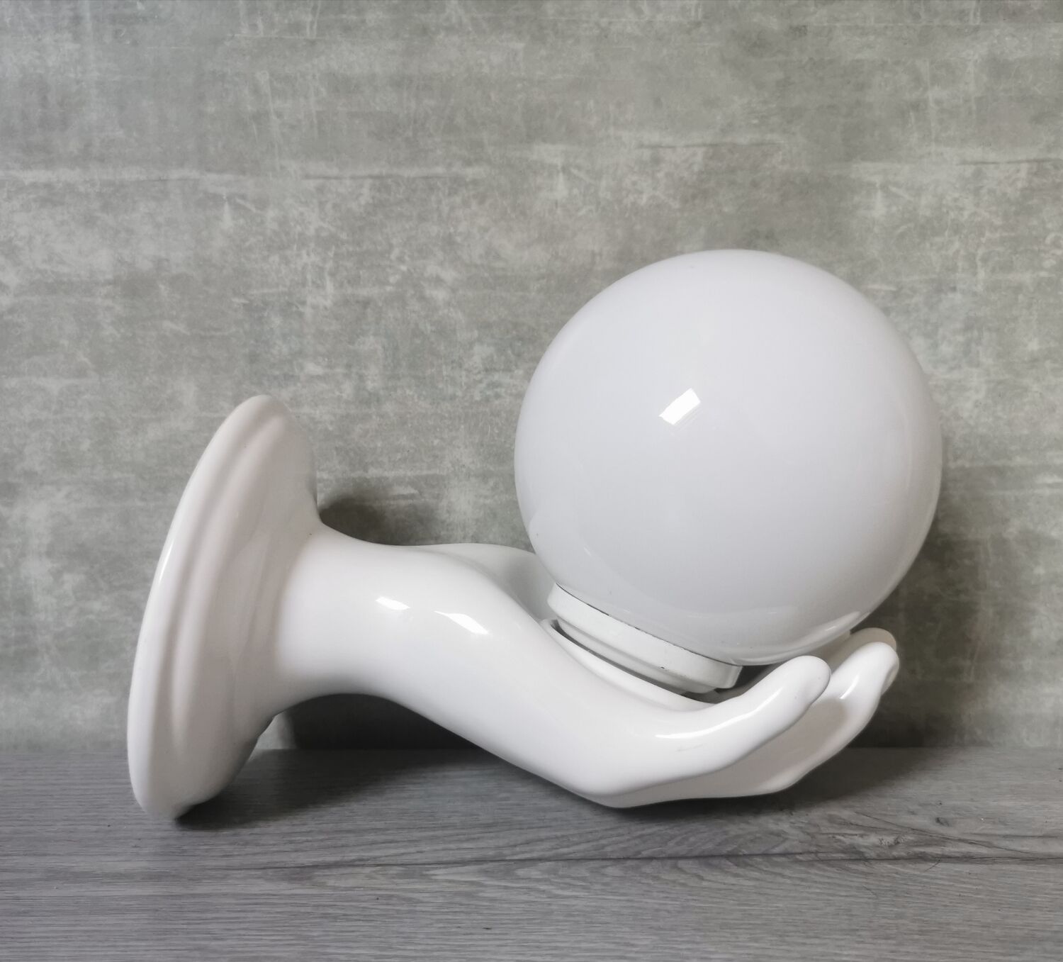 White ceramic hand wall lamp