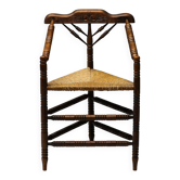 Mid Century Antiques spindle wood chaise with a rush seat.