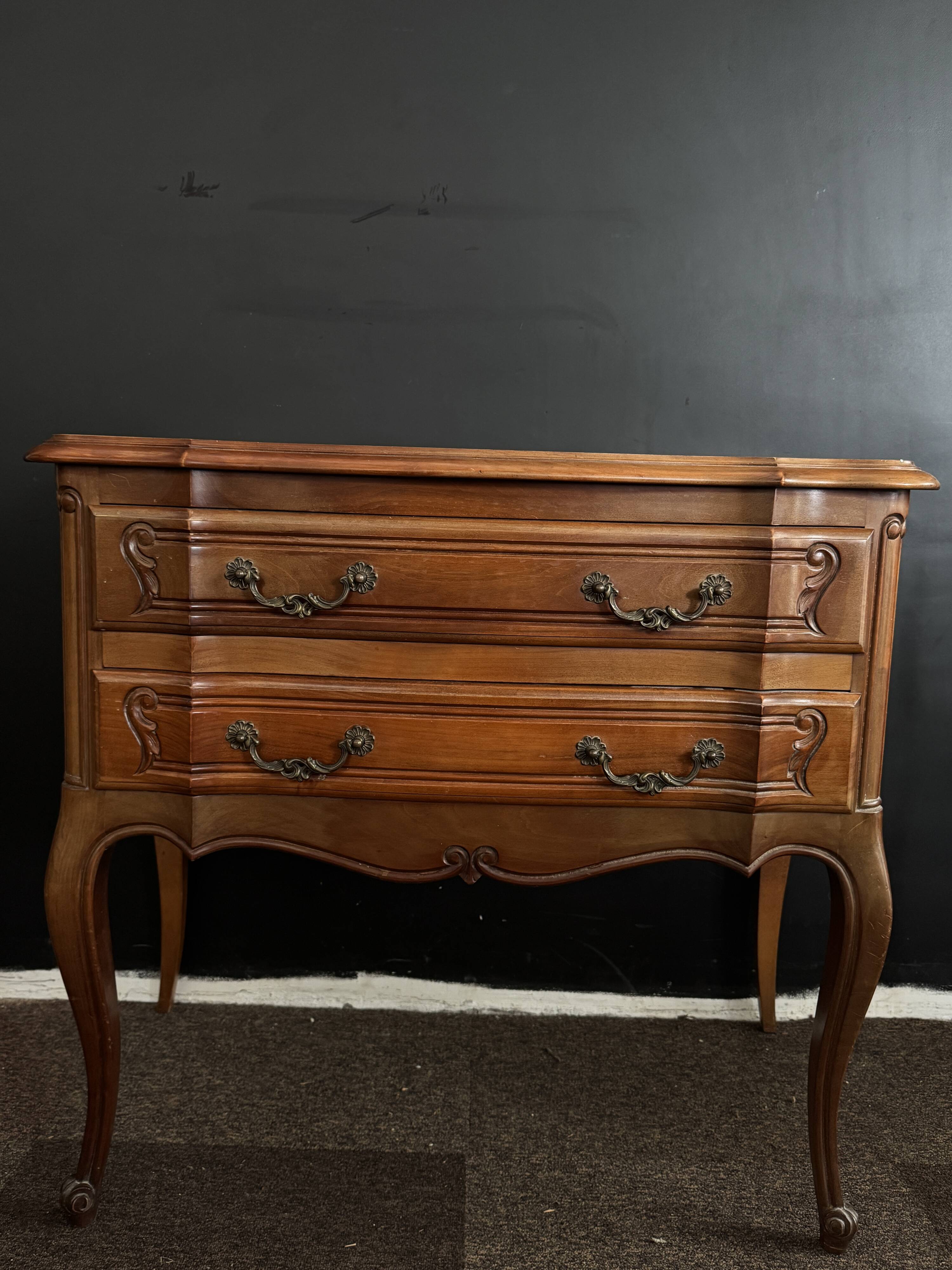 Carved wooden chest of drawers