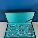 Set of 6 vintage silver metal knife holders and bottle opener, chev design