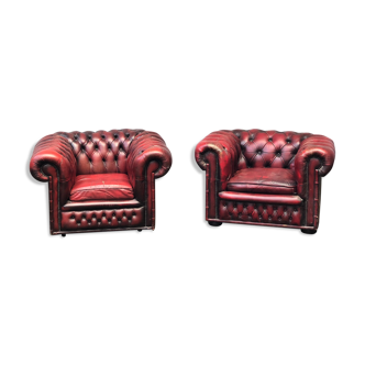 Pair of red leather chesterfield chairs
