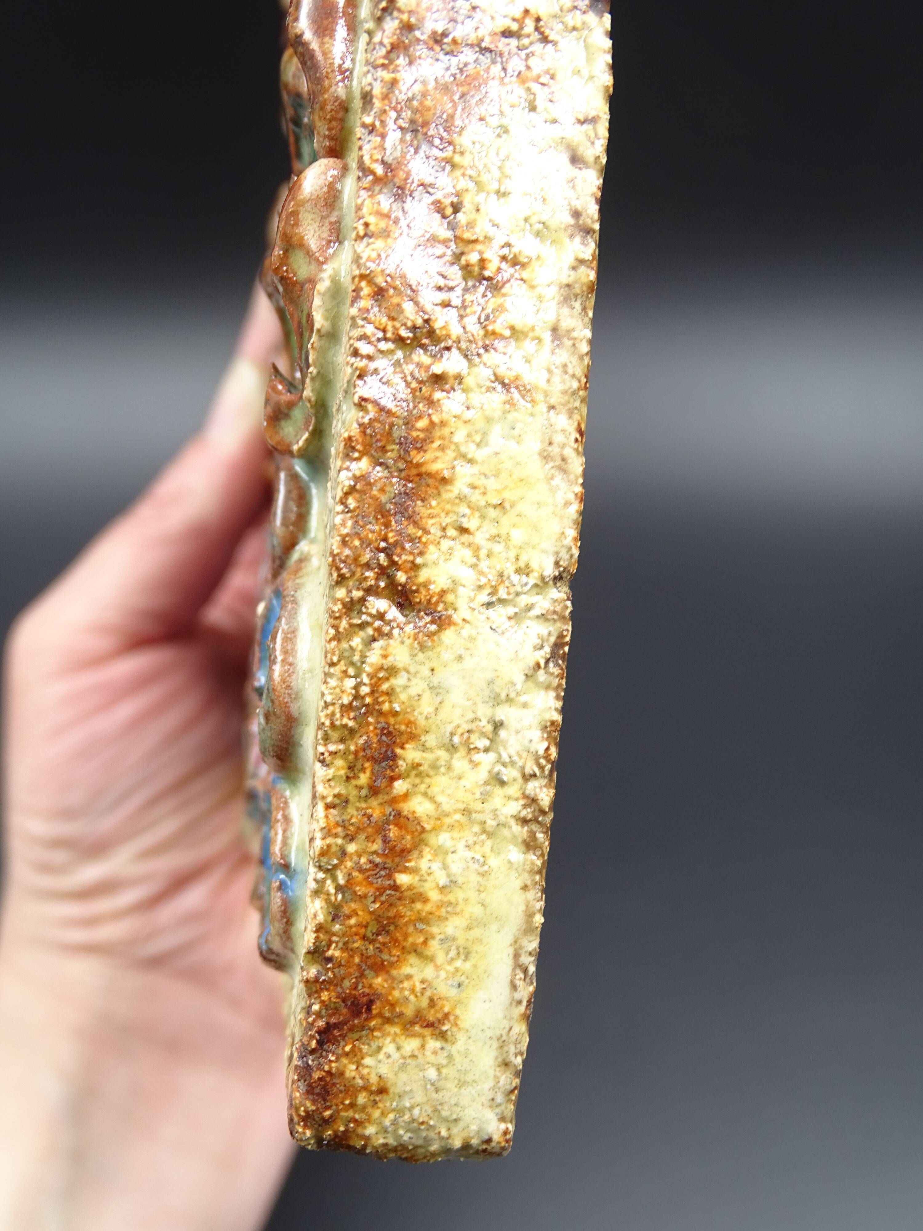 Flower-decorated sandstone mirror, circa 1970