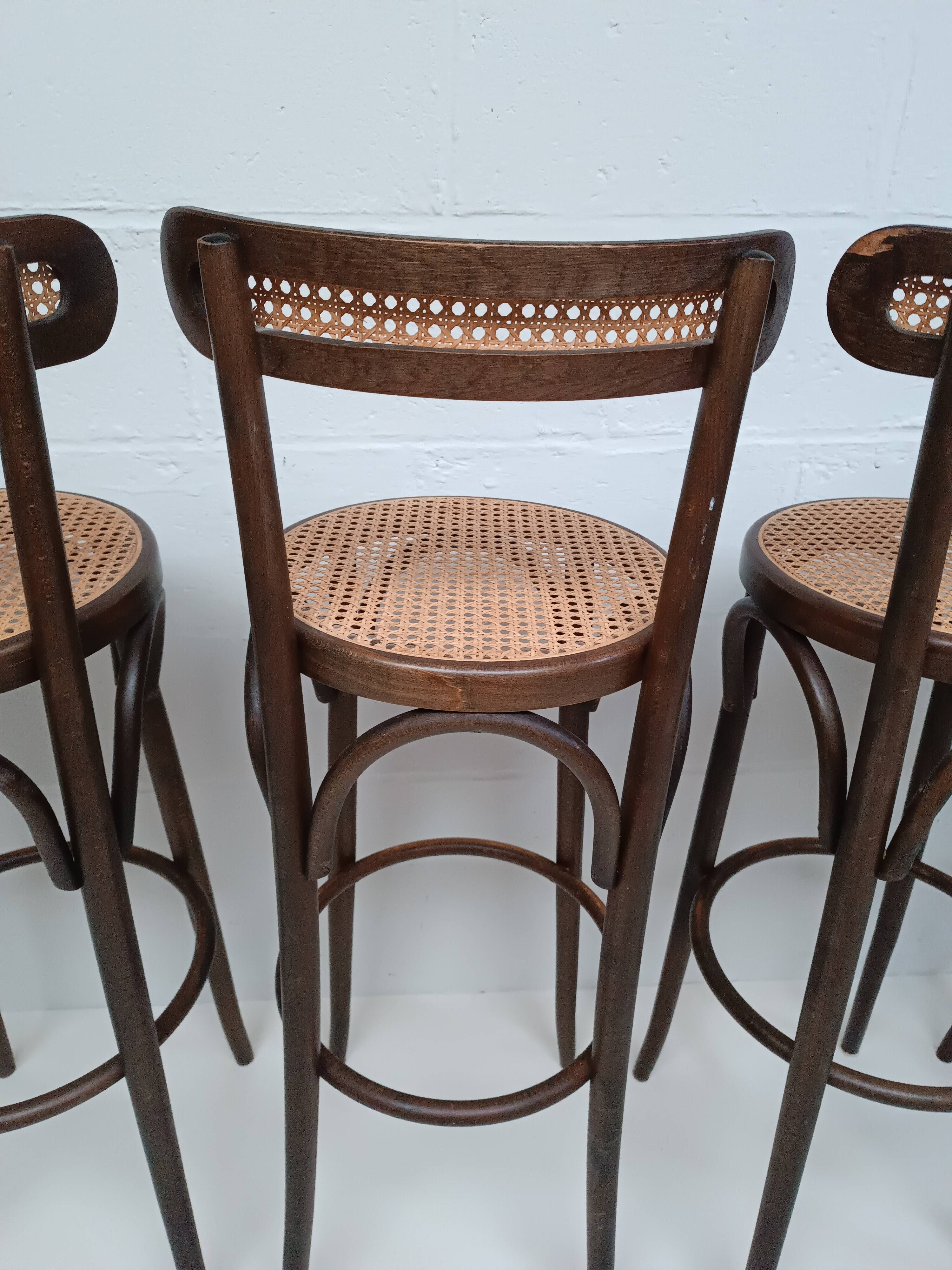 4 curved wood and cane bar stools