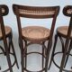 4 curved wood and cane bar stools