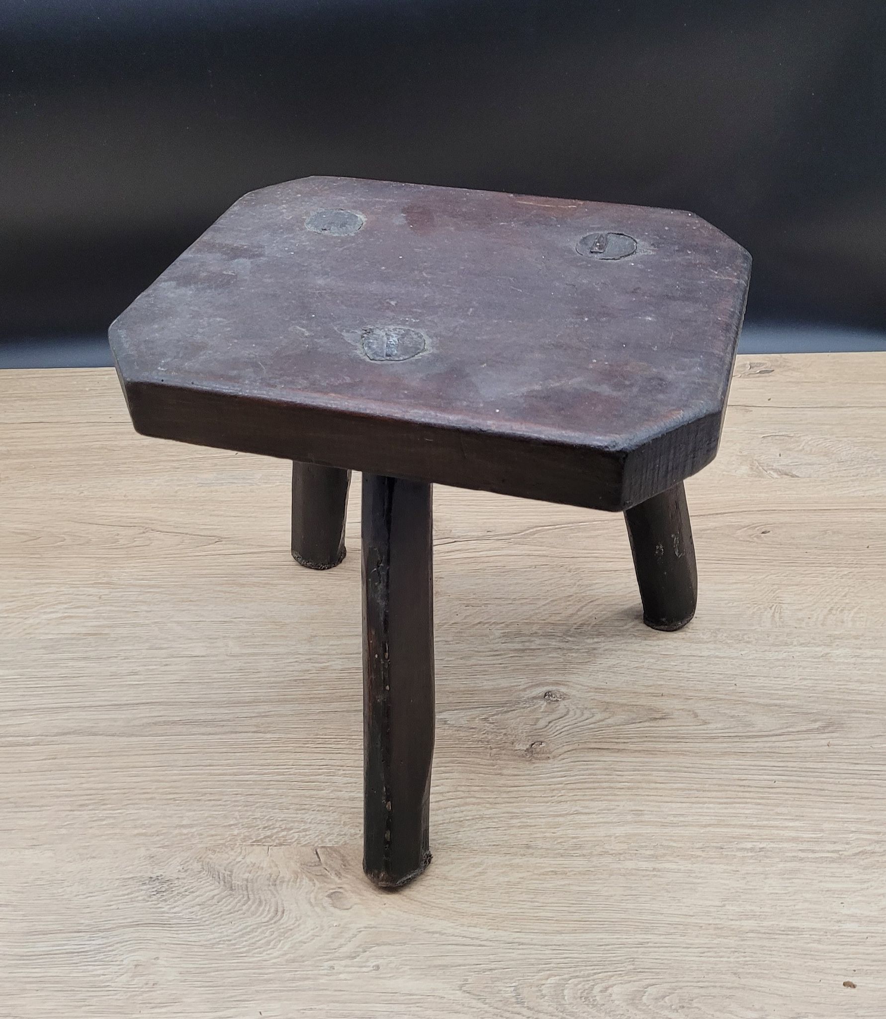 Dark octagon tripod stool