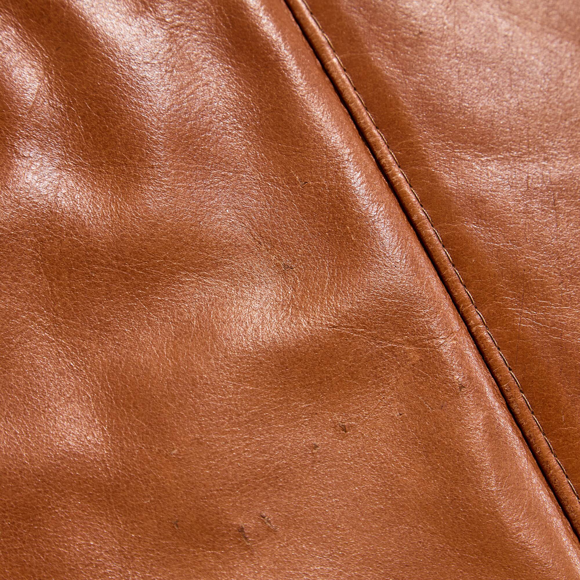 Ottoman with leather upholstery