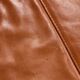 Ottoman with leather upholstery