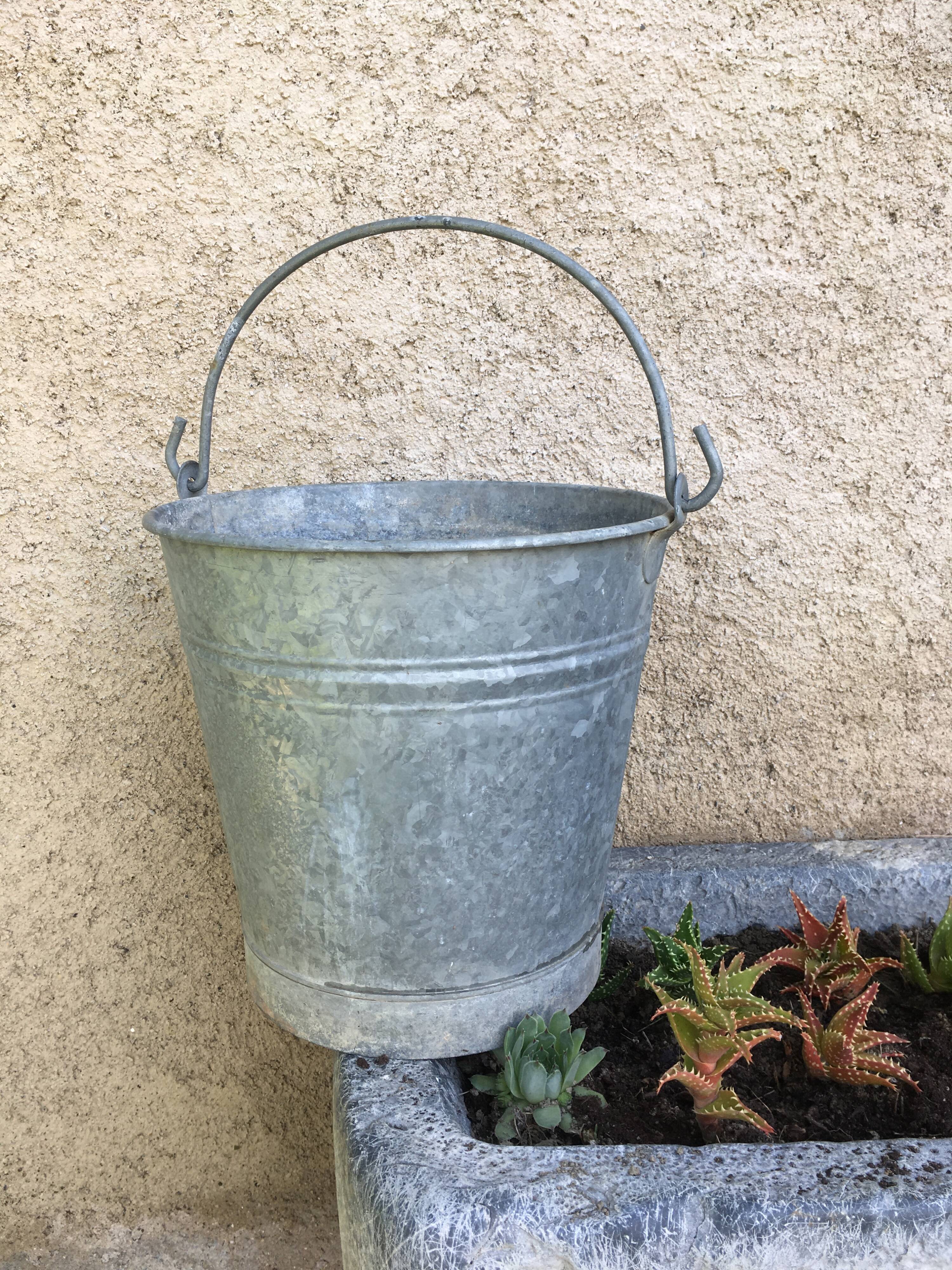 Old bucket in vintage zinc pot cache