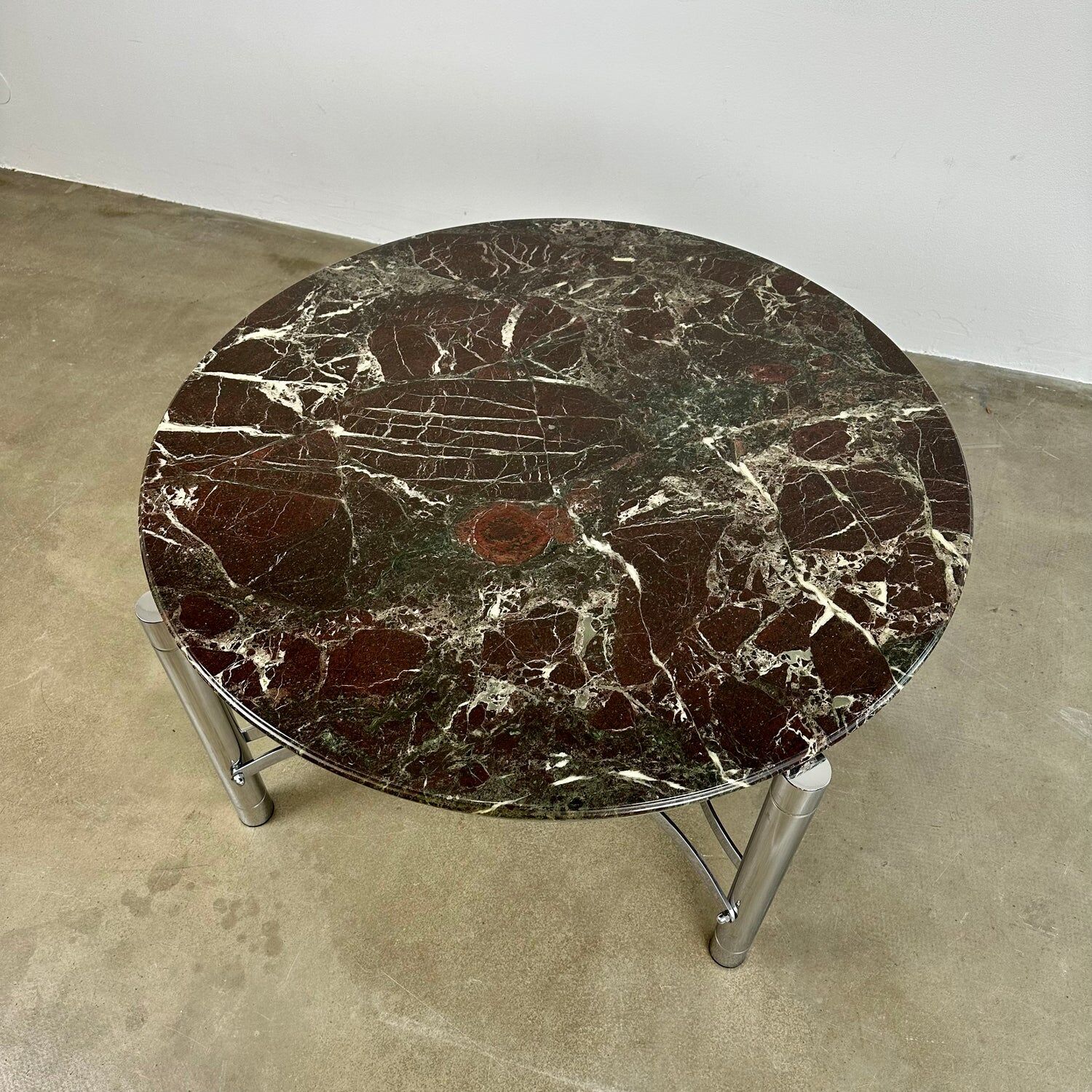 Coffee table with marble top and chrome base