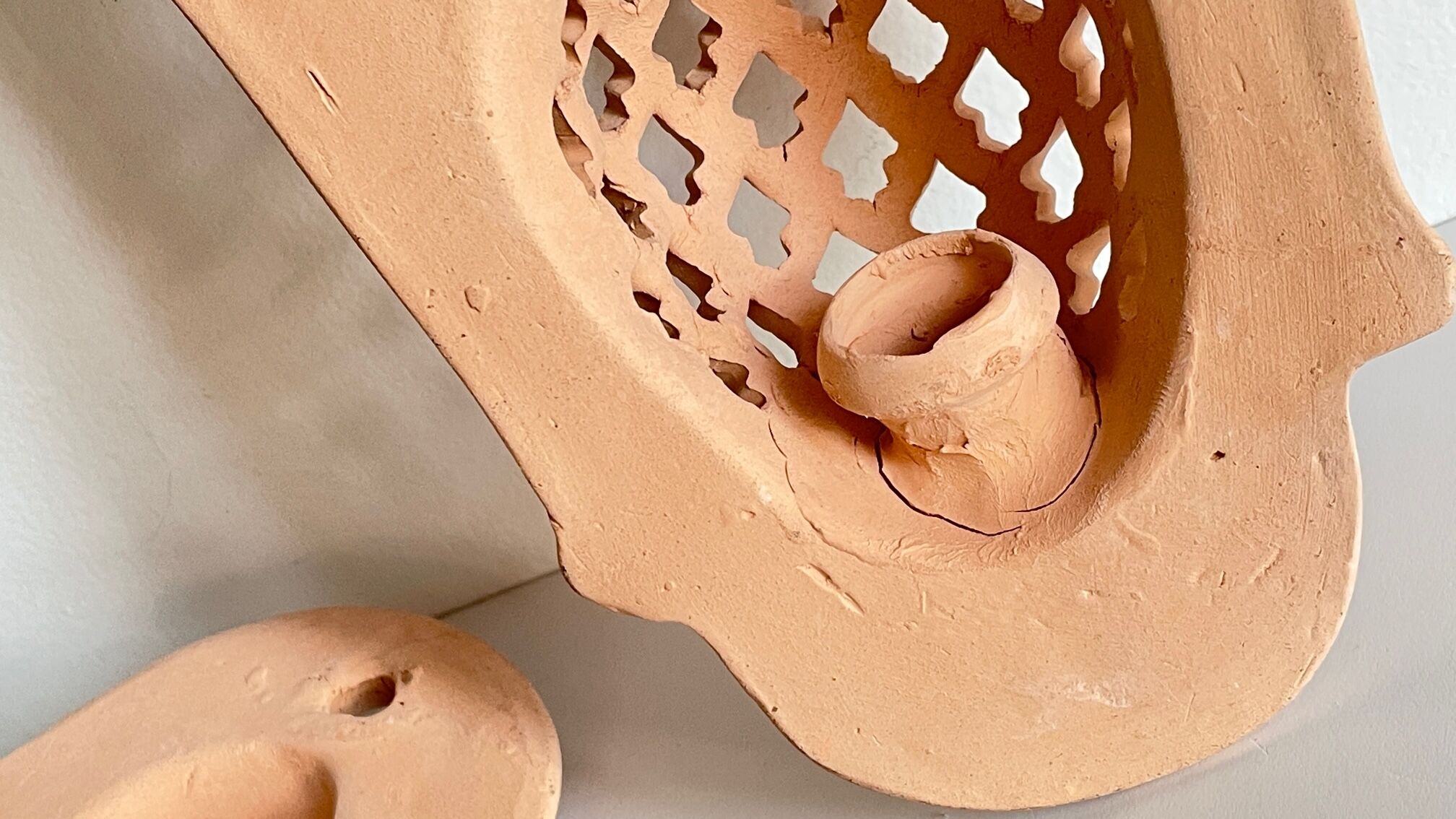 Pair of terracotta wall candle holders