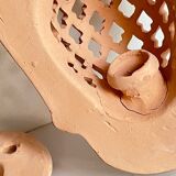 Pair of terracotta wall candle holders