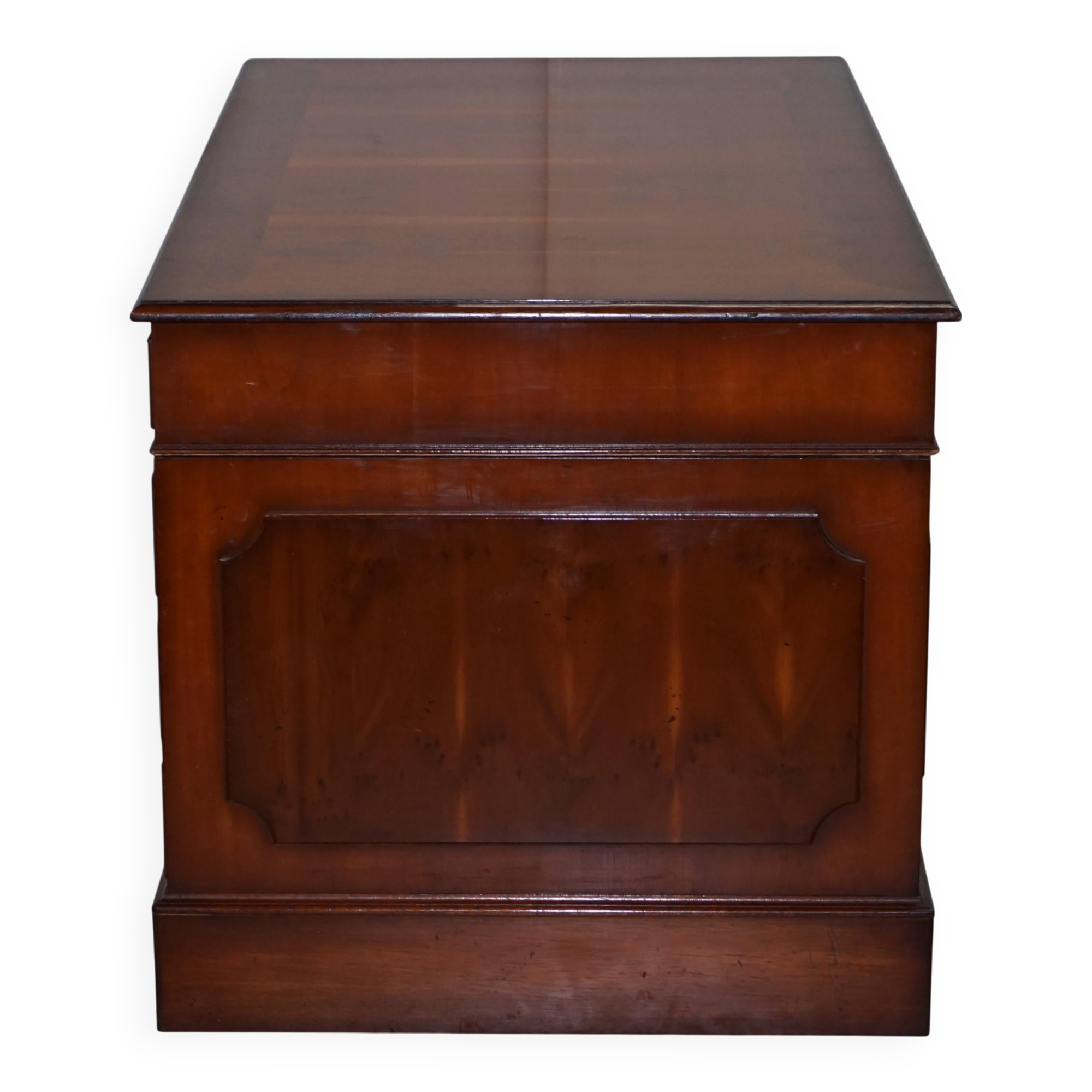 Partner desk with double pedestal in burr yew wood with decorated top.
