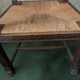 Antique armchair in carved wood and straw seat