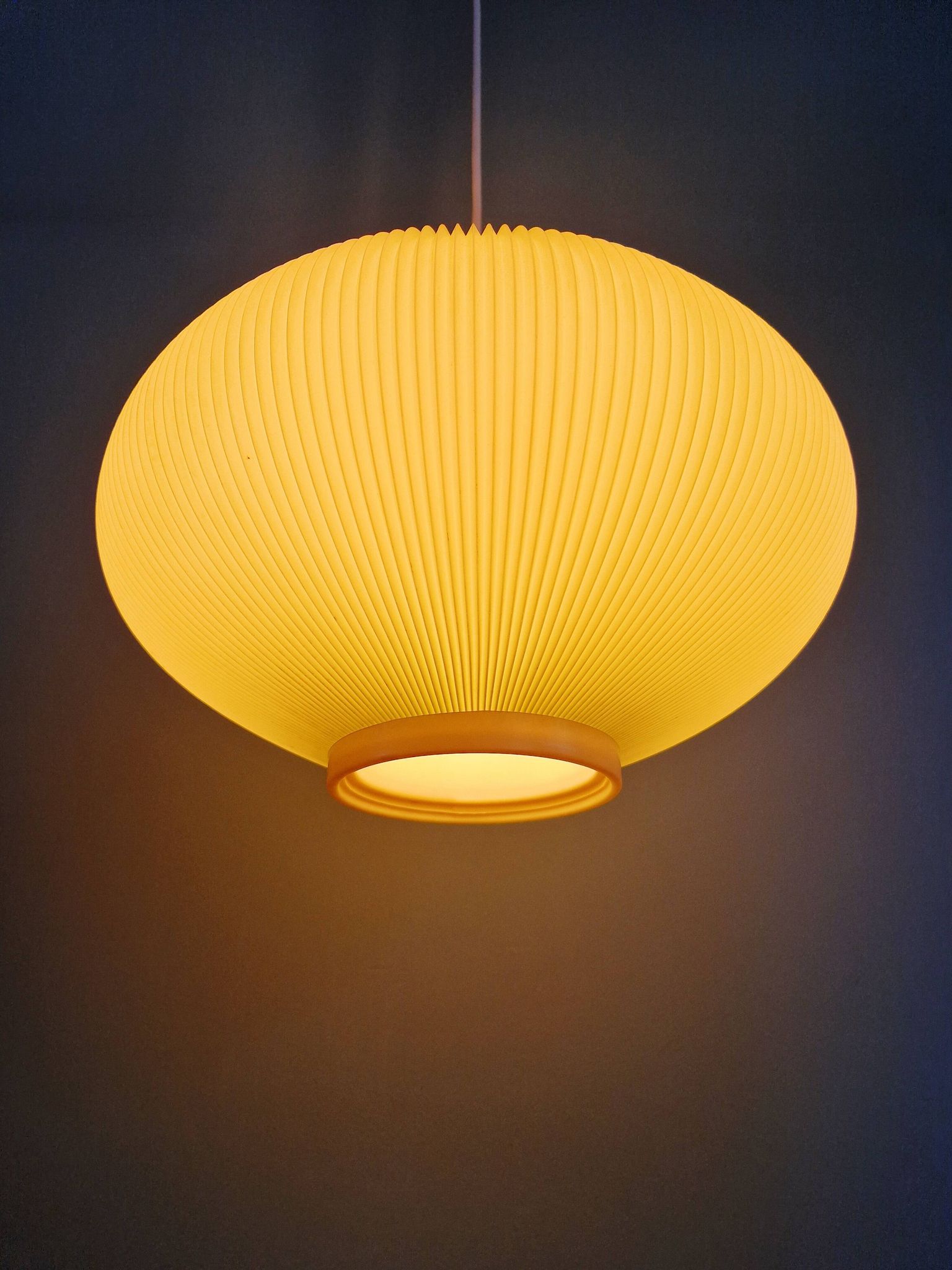 Vintage oval-shaped suspension in pleated celluloid, light green colour, 1960.
