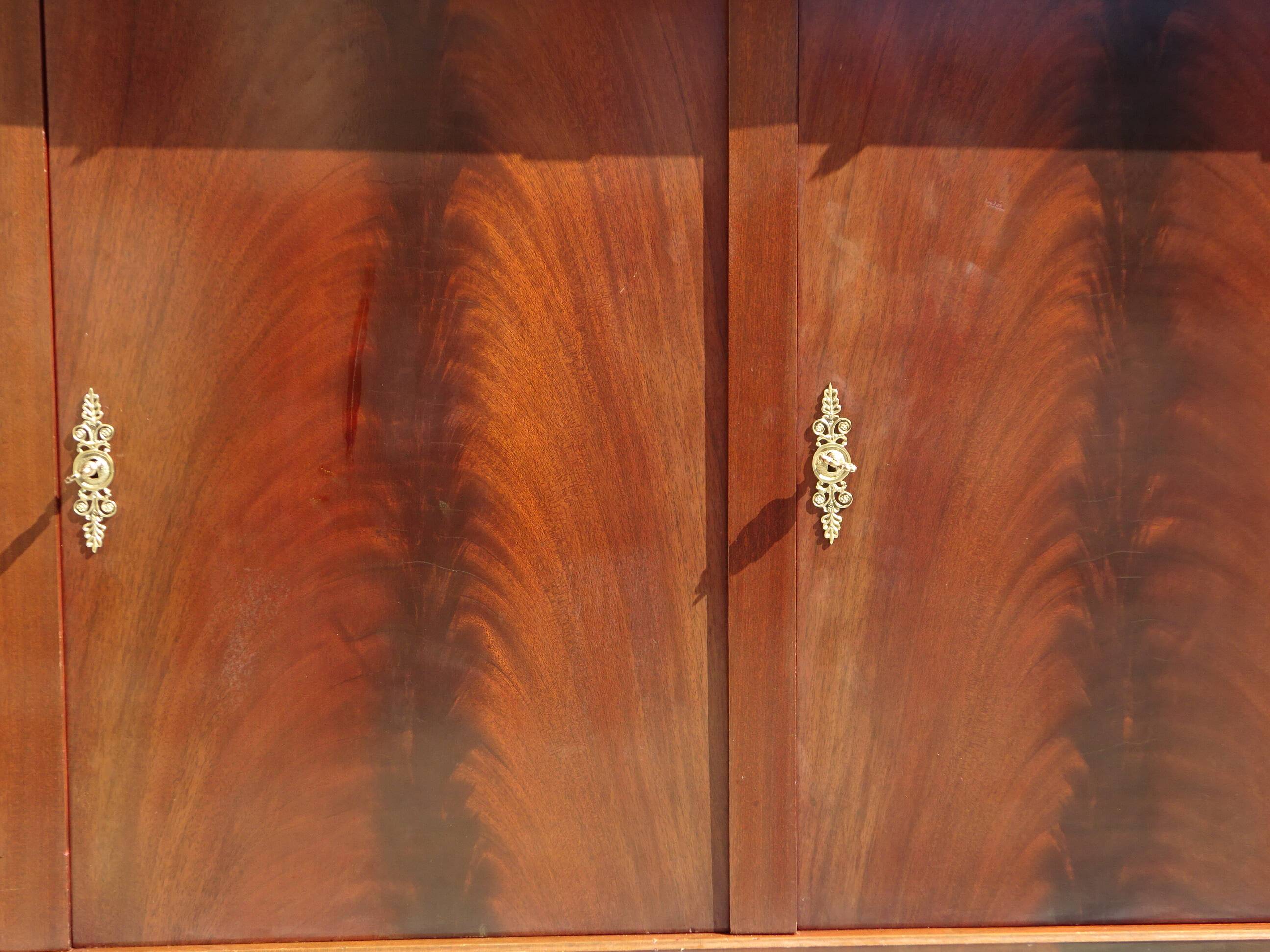 Flamed mahogany enfilade with sea green marble in Empire style.