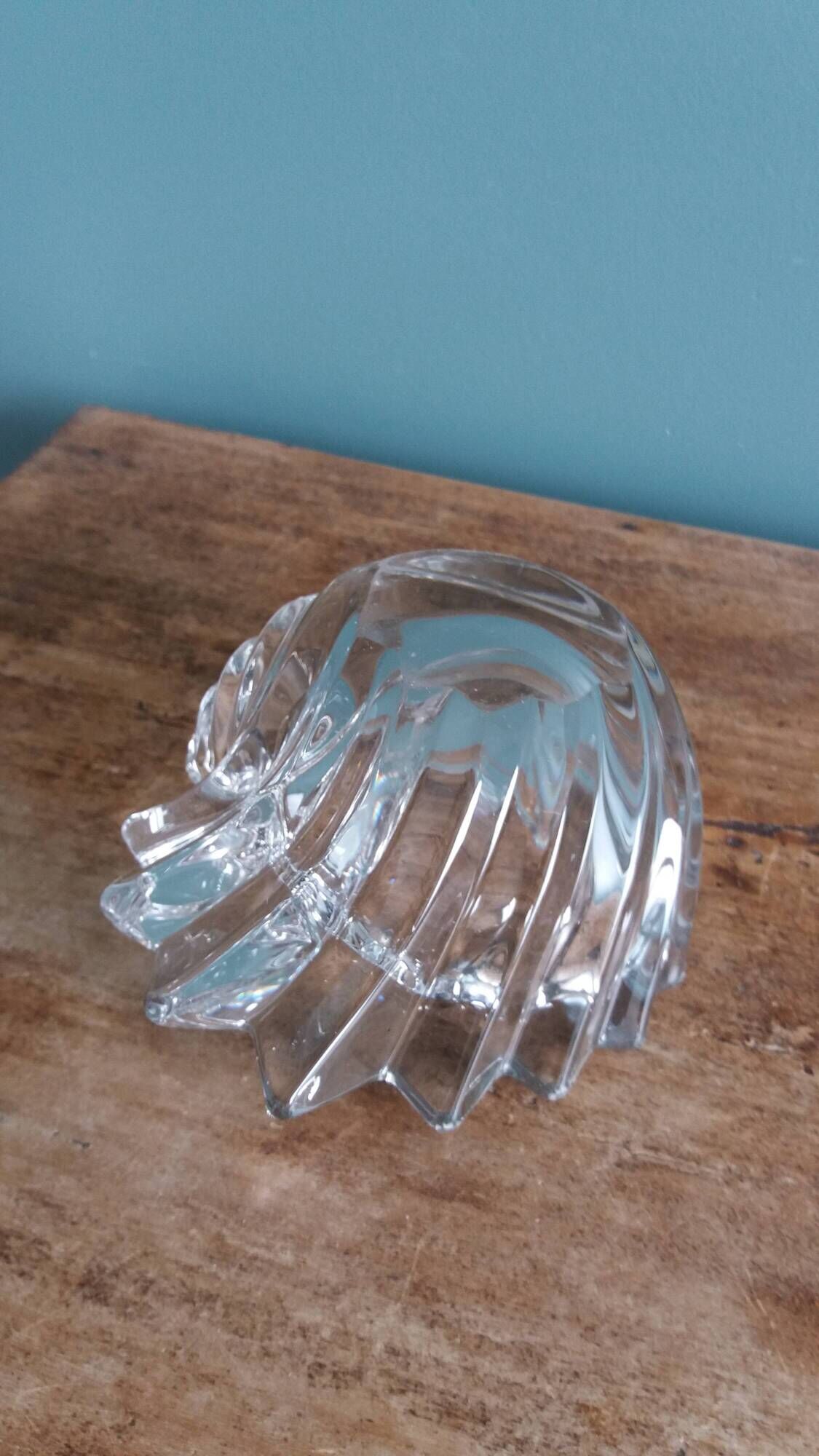 Shell-shaped crystal paperweight.
