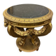 A round Louis XV style table in carved gilt beechwood with a black marble top