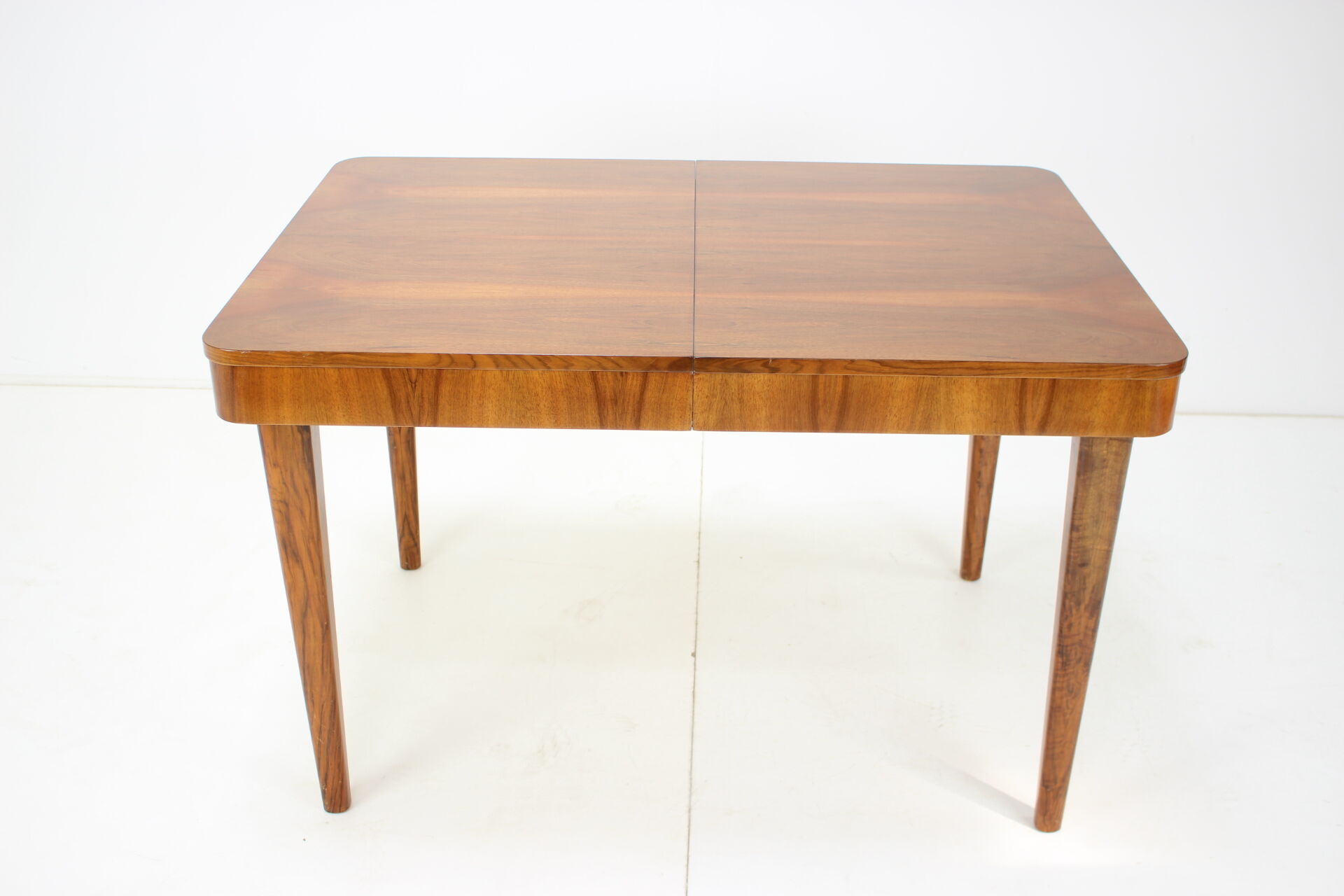 Extendable dining table designed by Jindřich Halabala for UP Závody, 1957.