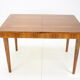 Extendable dining table designed by Jindřich Halabala for UP Závody, 1957.