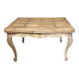 Walnut table, two extensions, parquet top, carved crosspiece