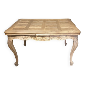 Walnut table, two extensions, parquet top, carved crosspiece
