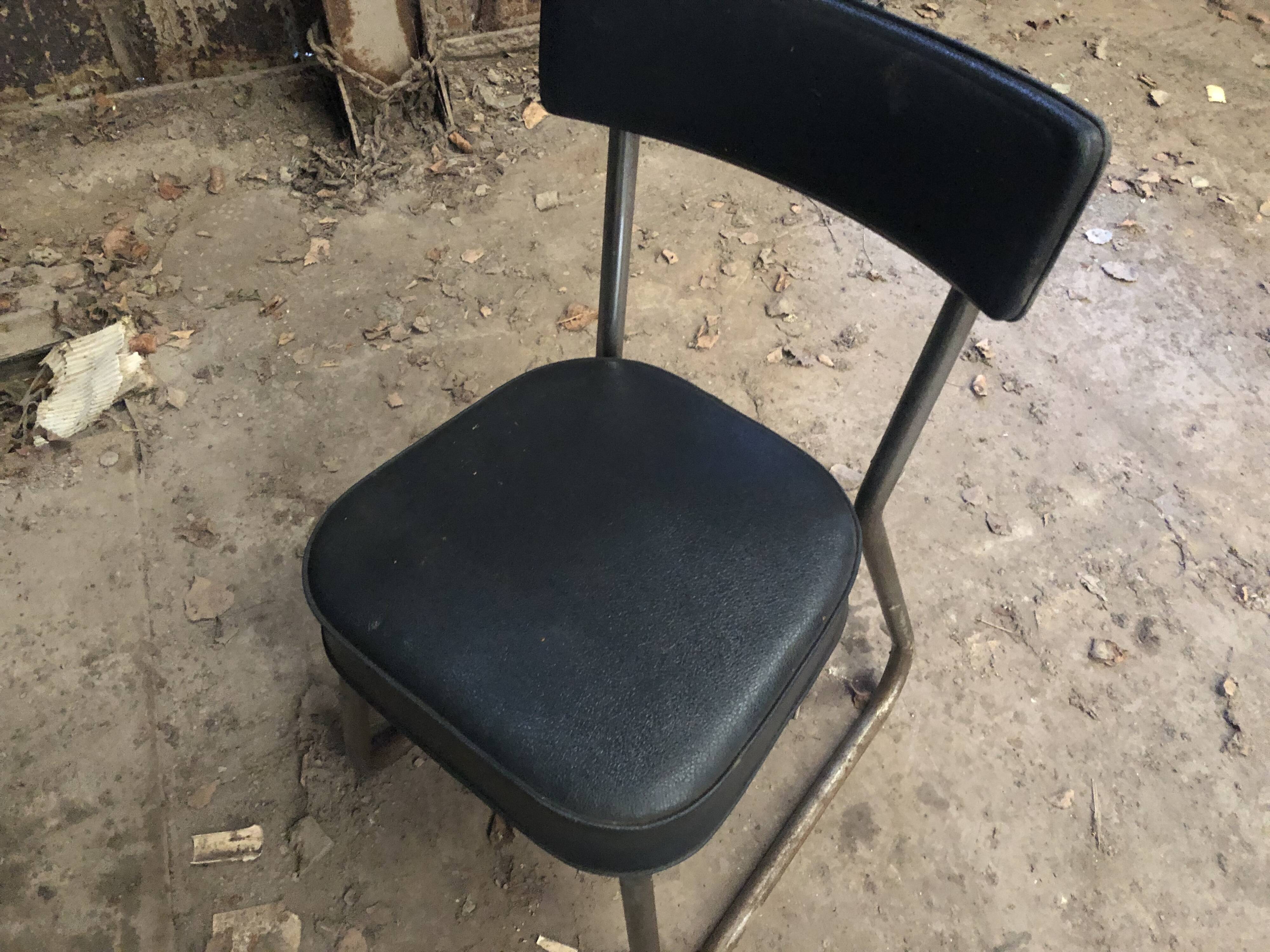 Old metal desk with chair