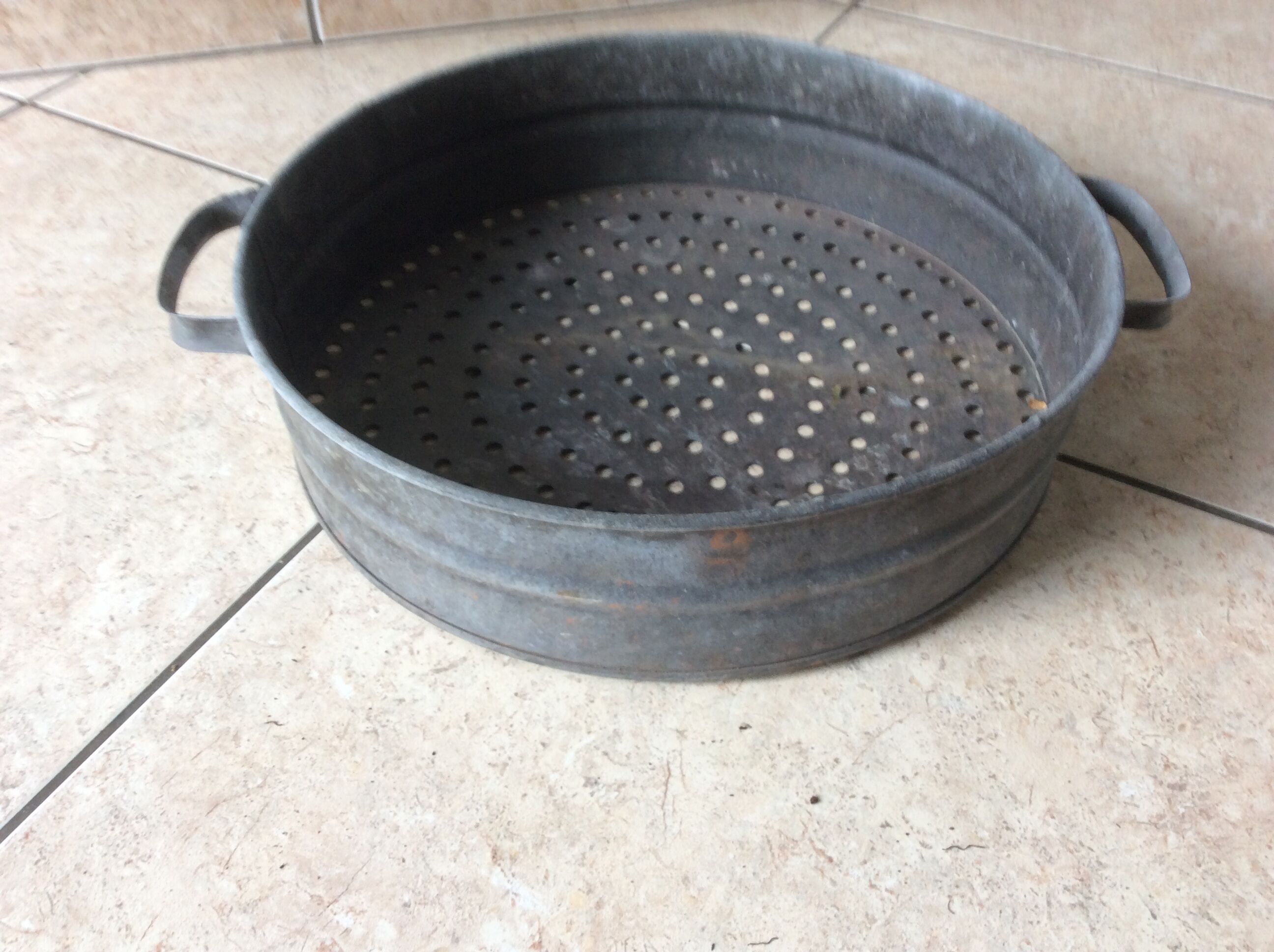 Ancient zinc sieve