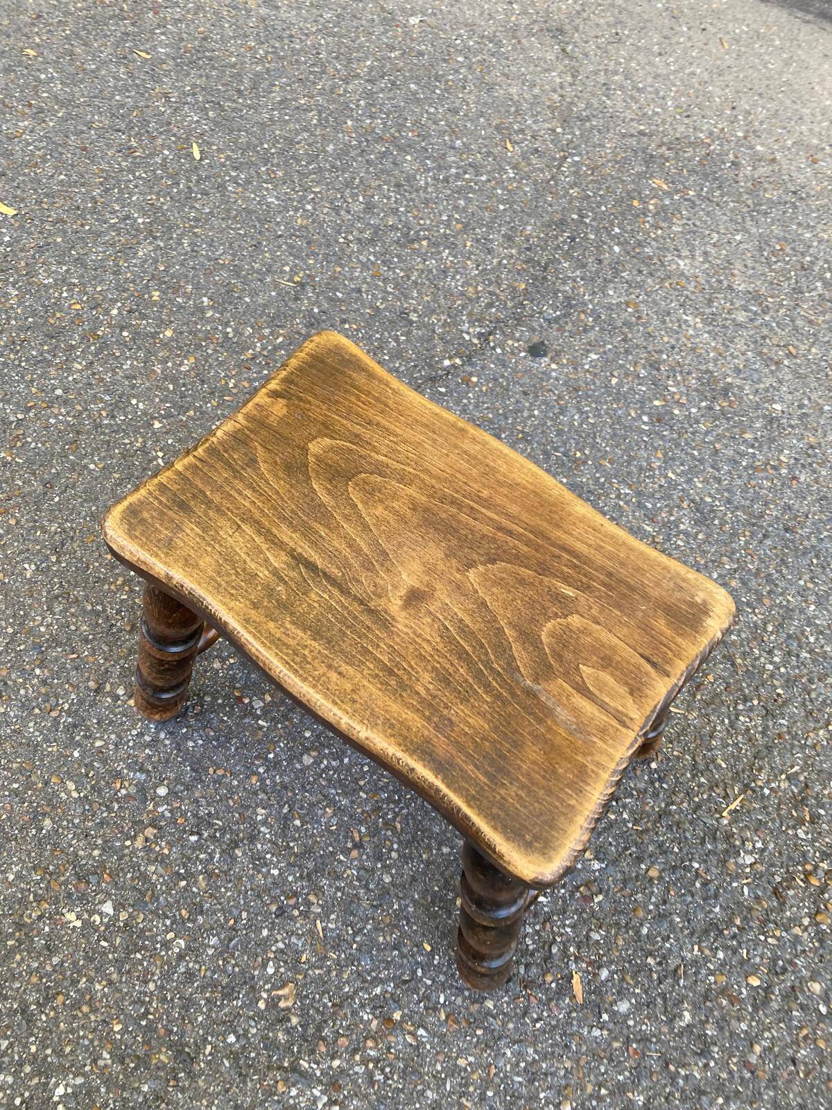 Small vintage low stool made of turned solid wood footrest 1960