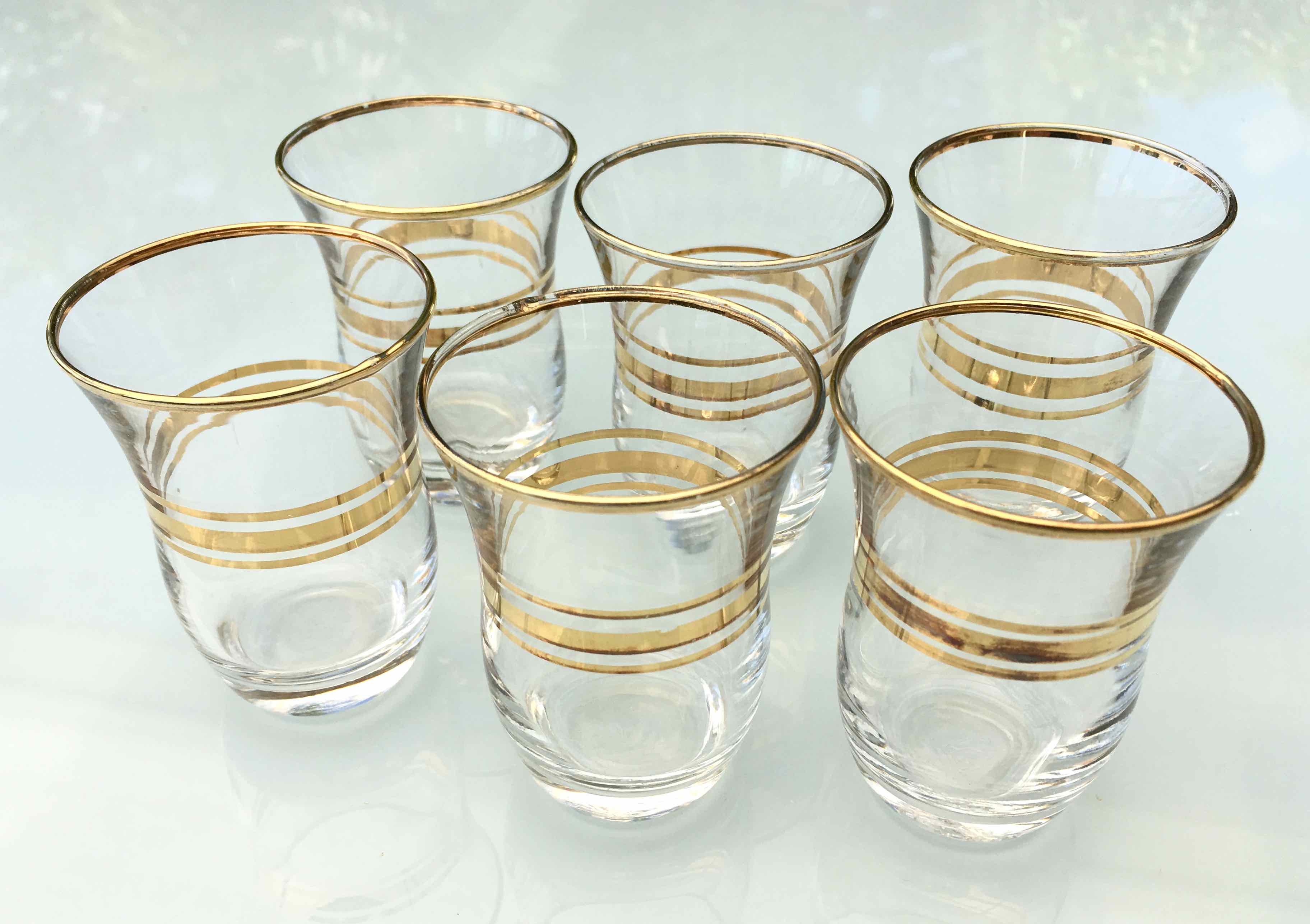 Six glasses of vintage alcohol cups