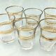 Six glasses of vintage alcohol cups