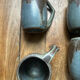Set of 4 cups and 1 signed brutalist tray.