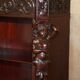 Hand-carved library circa 1900 in hardwood with Hermes statues.