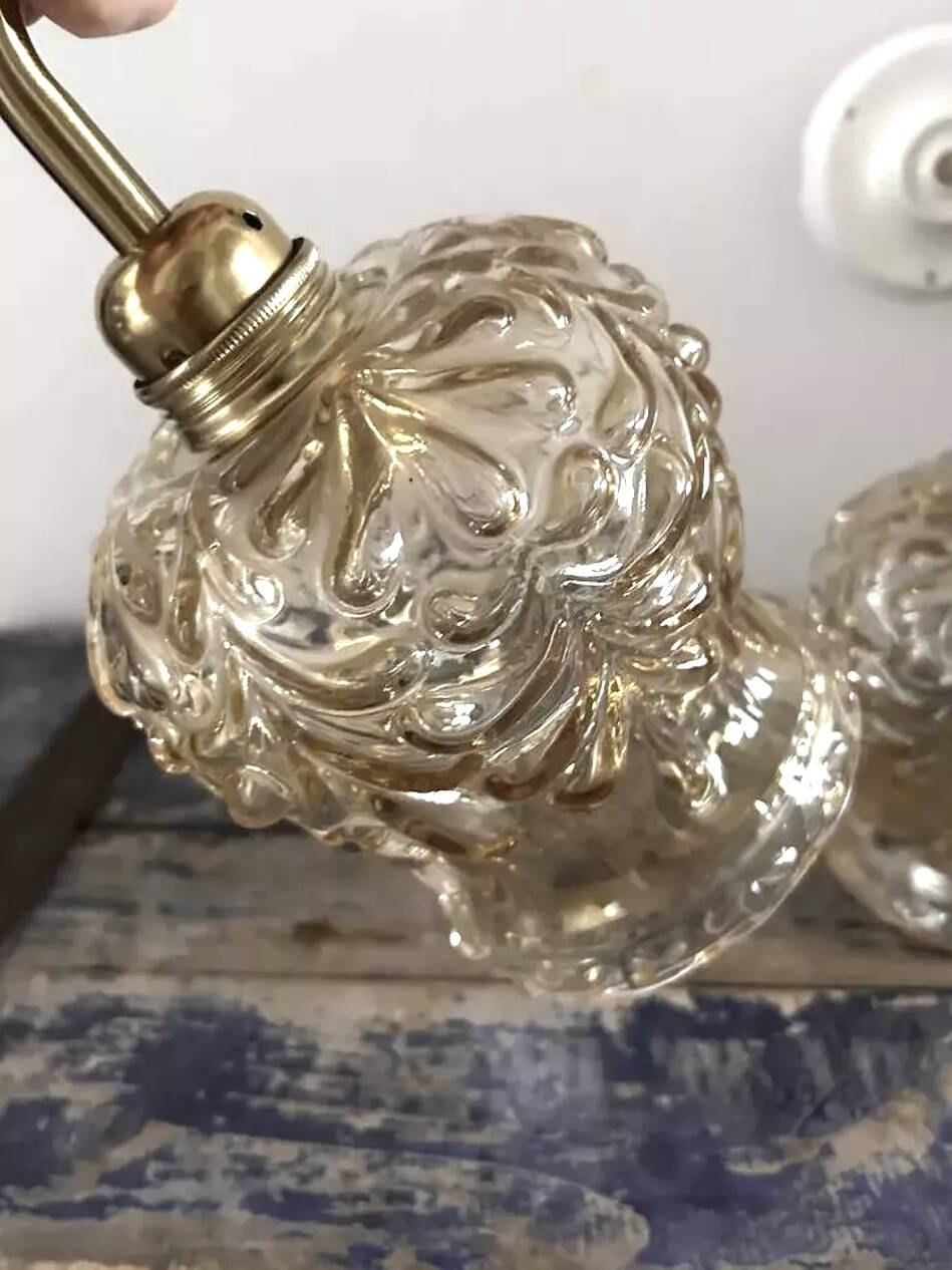 Pair of gold wall sconces