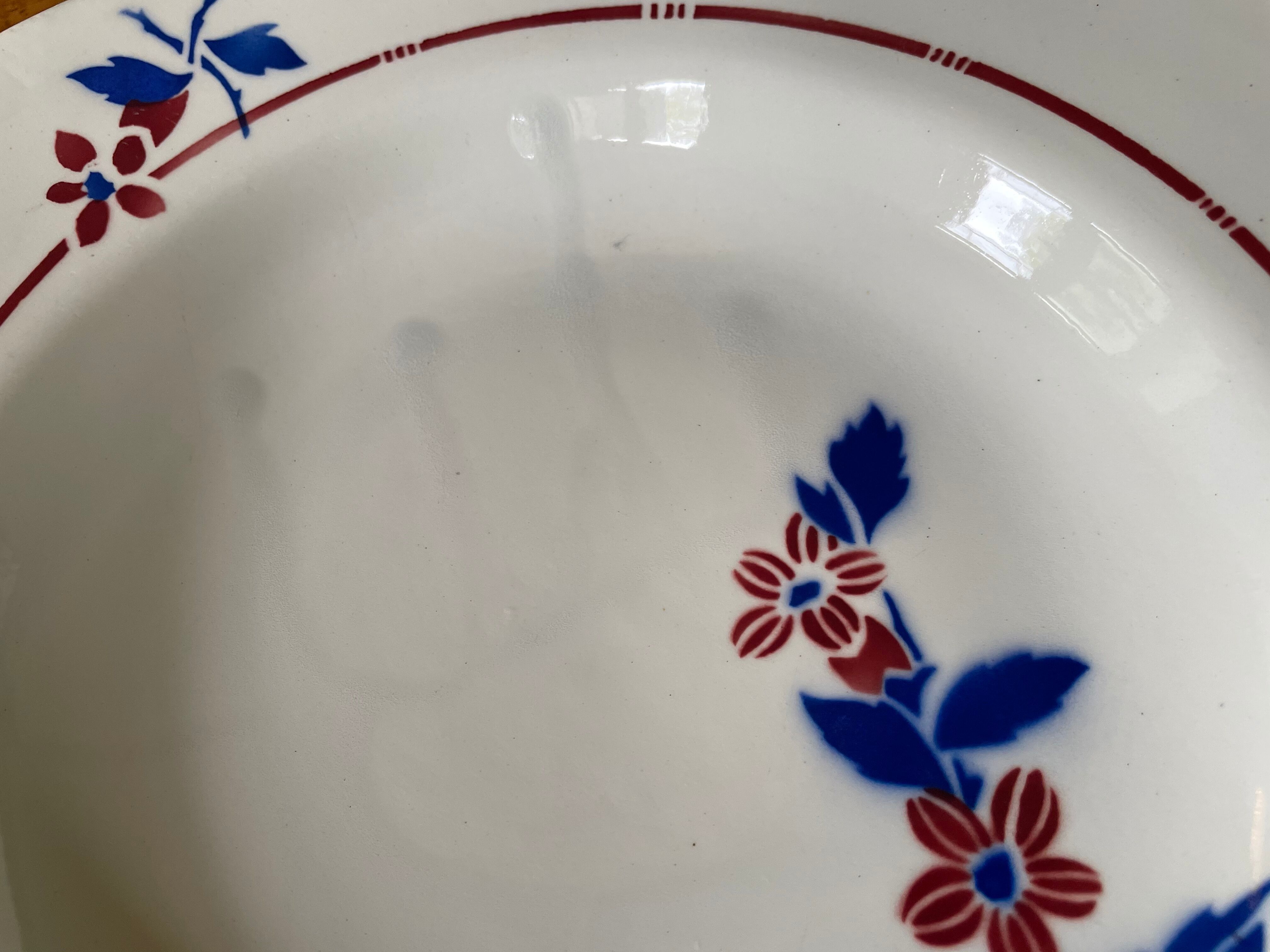 Saint Amand hollow plates decorated with red and blue flowers