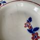 Saint Amand hollow plates decorated with red and blue flowers