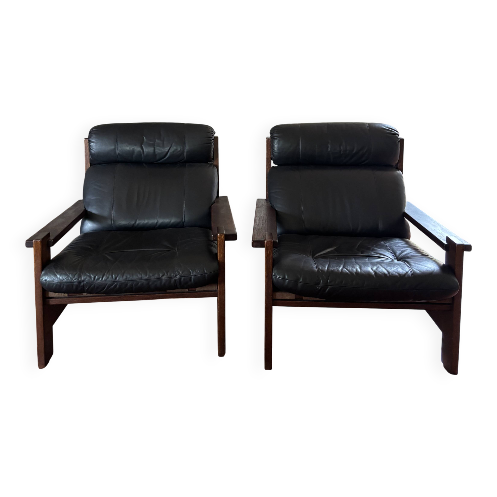 Vintage Scandinavian armchairs in leather and solid wood.