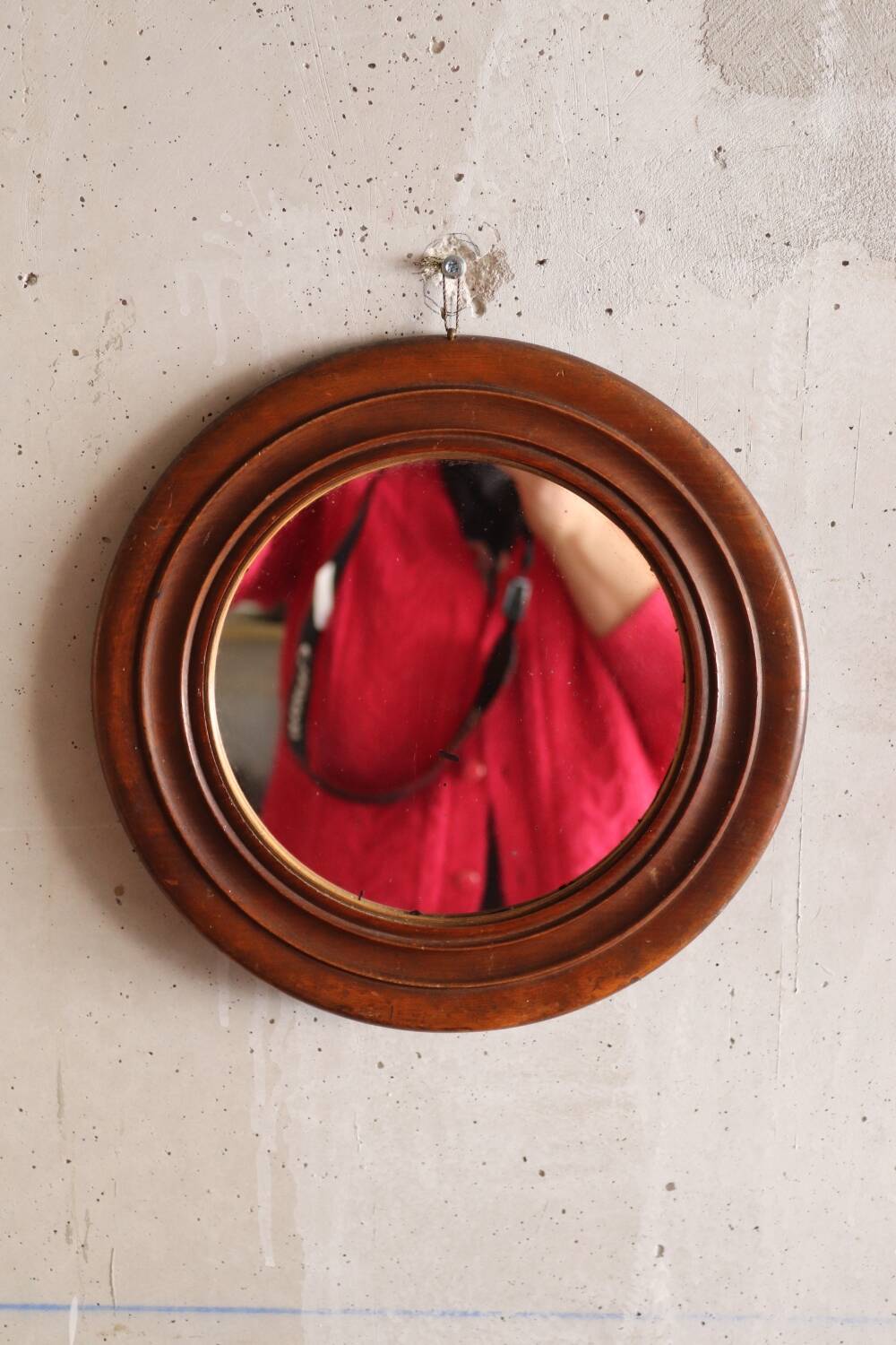 Round old wooden mirror