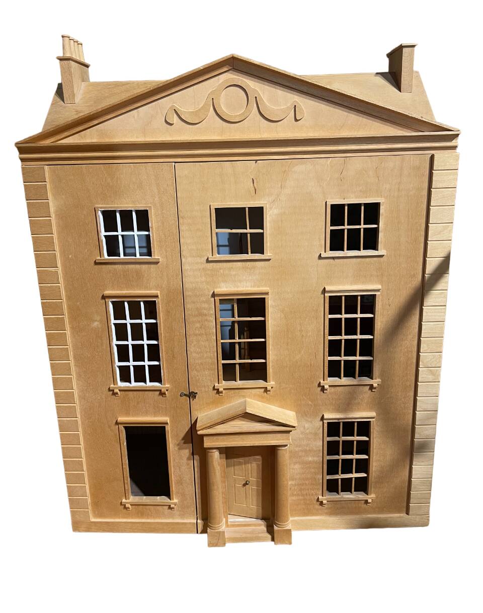 Large wooden dollhouse with miniature furniture
