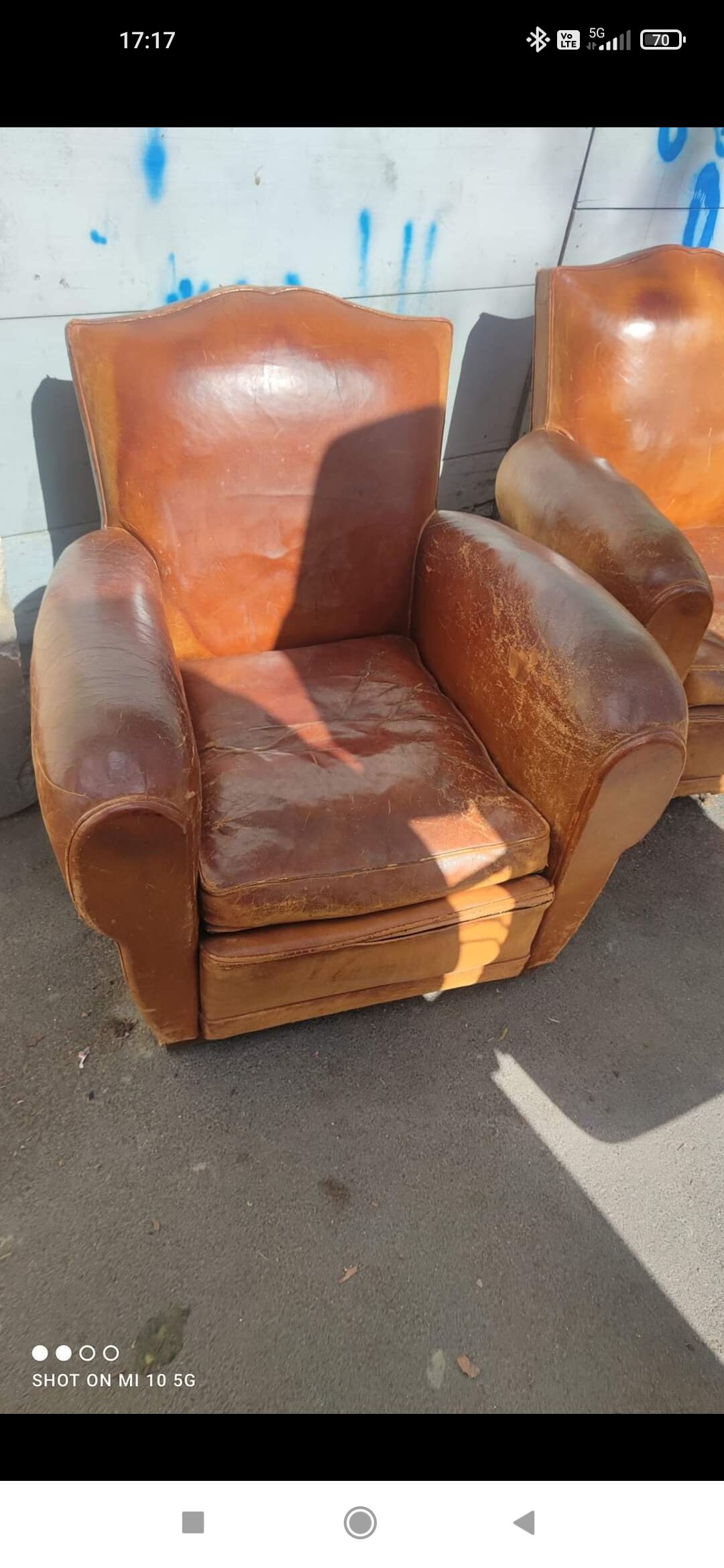 Pair of club chairs with moustache-shaped handles in Havana leather, in their original condition, circa 1930