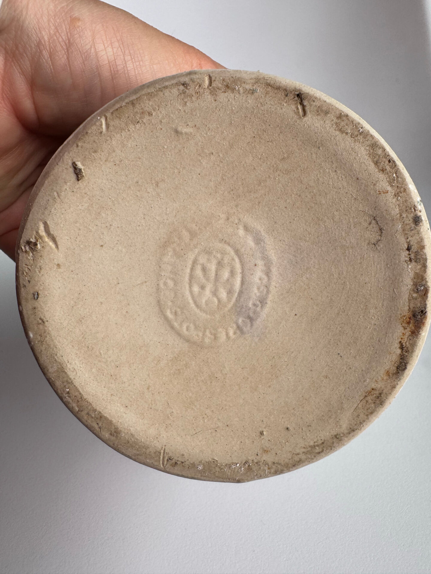 Old white ceramic bottle